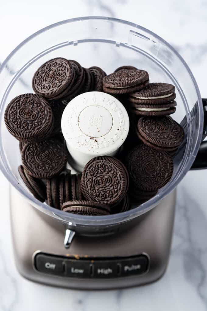 Whole Oreo cookies in a food processor.