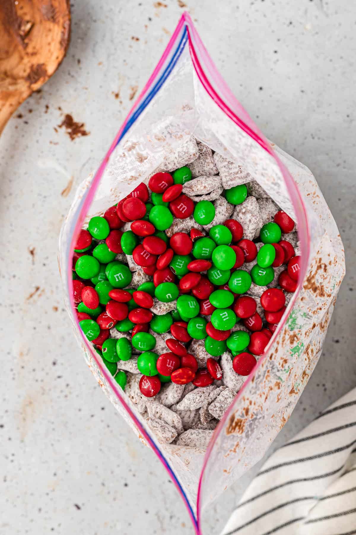 Adding holiday mix-ins to puppy chow.