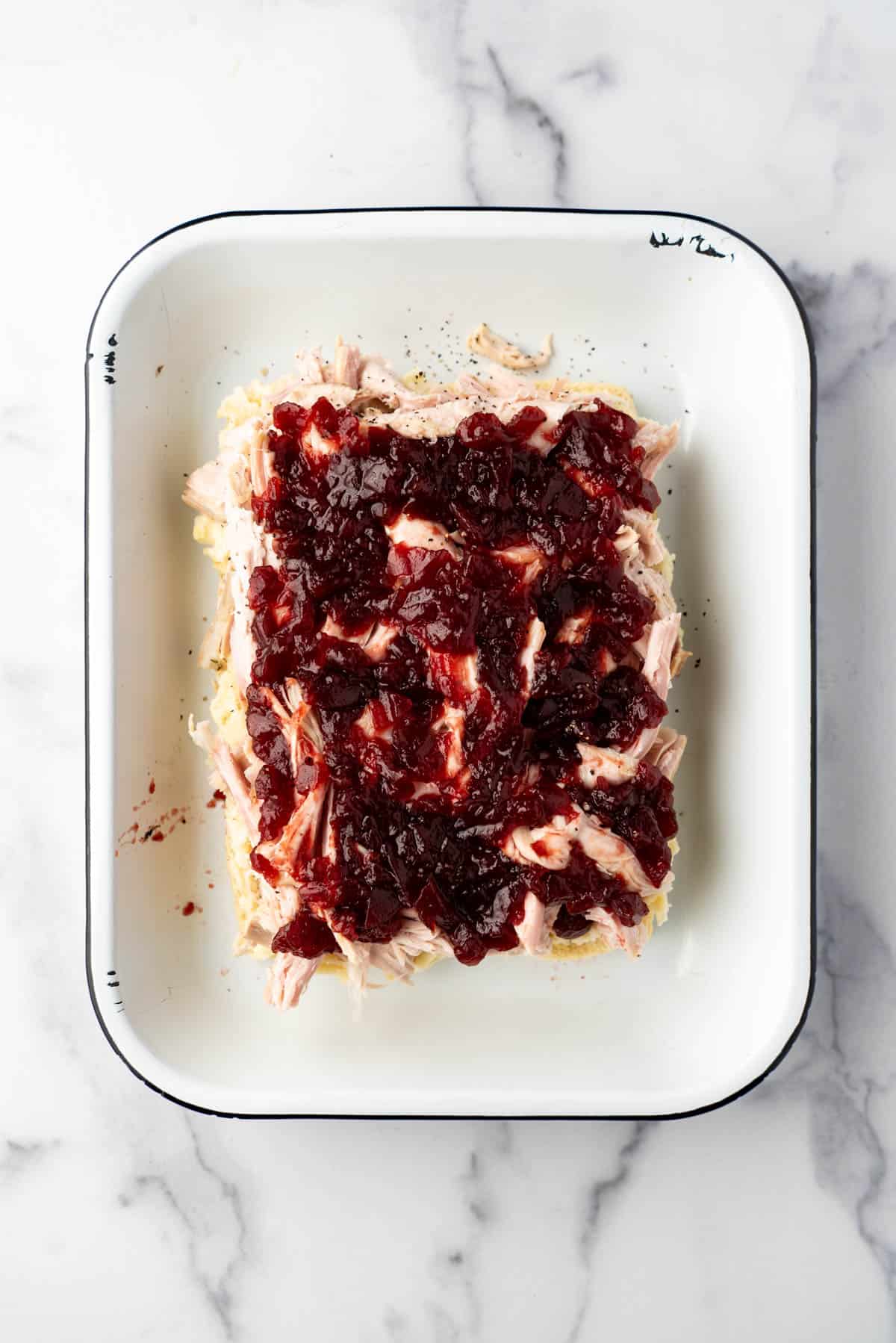 Jellied cranberry spread on top of shredded turkey sliders.