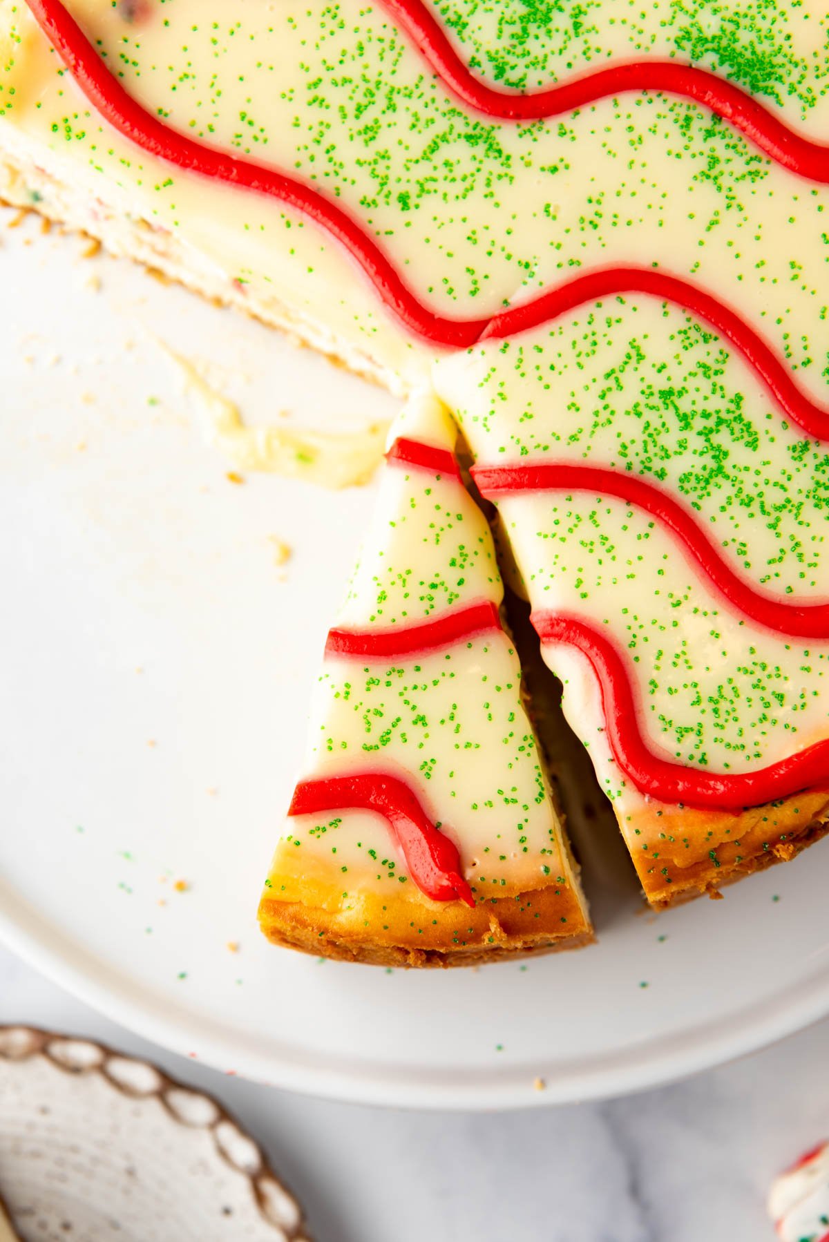 A close image of a slice of Little Debbie Christmas Tree Cheesecake.