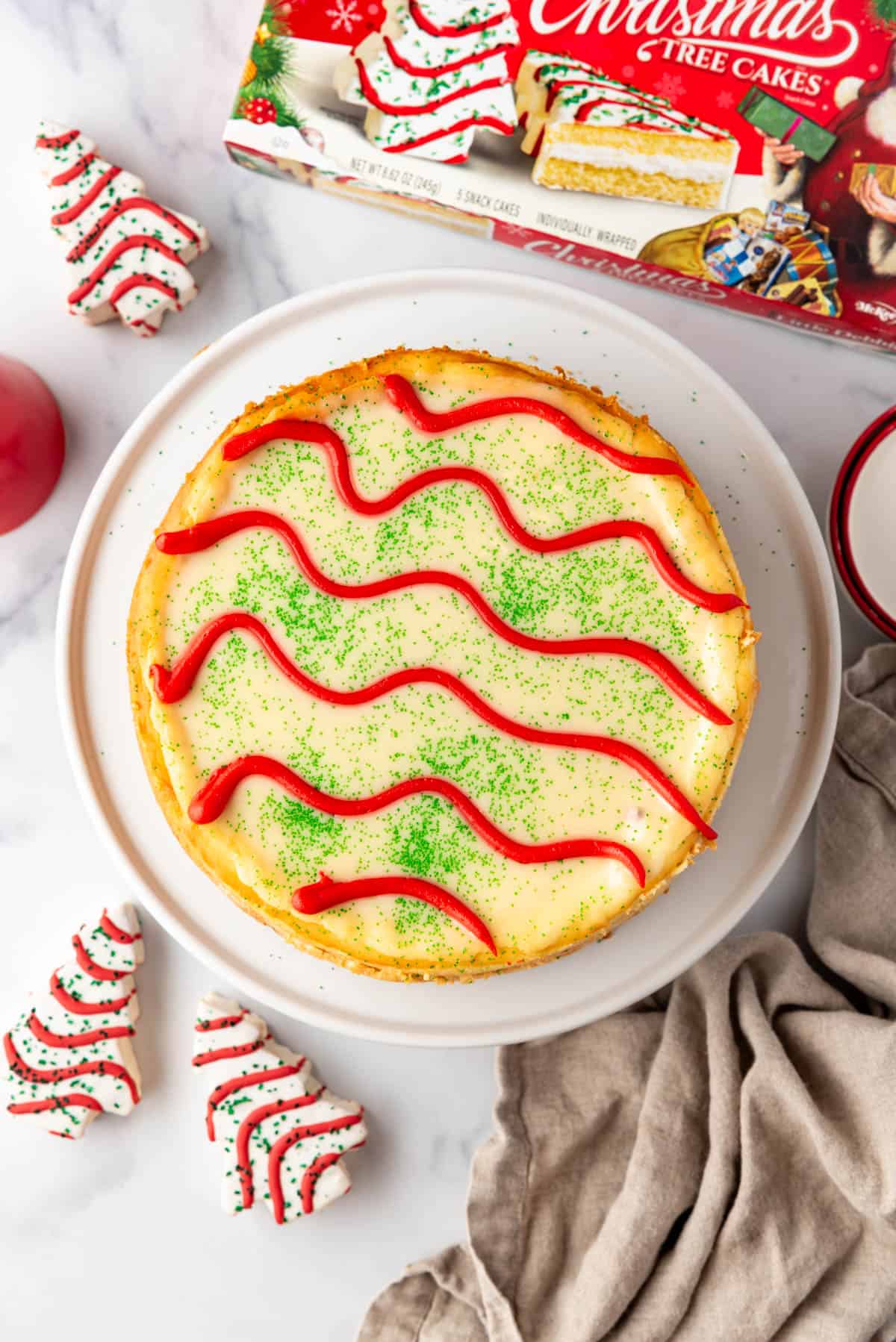 An overhead image of a decorated Little Debbie Christmas Tree Cheesecake.