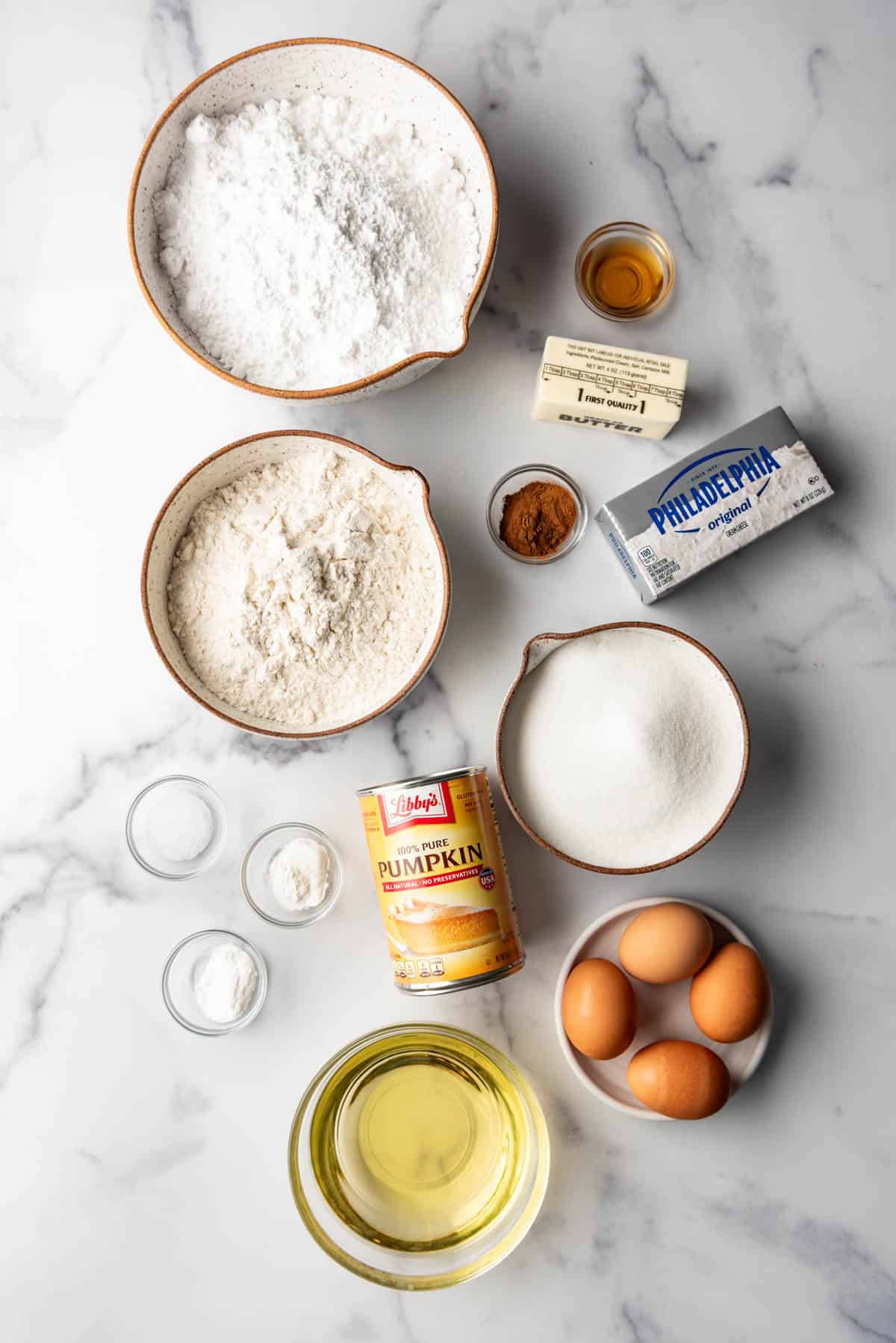 An overhead image of ingredients arranged for pumpkin bars with cream cheese frosting.