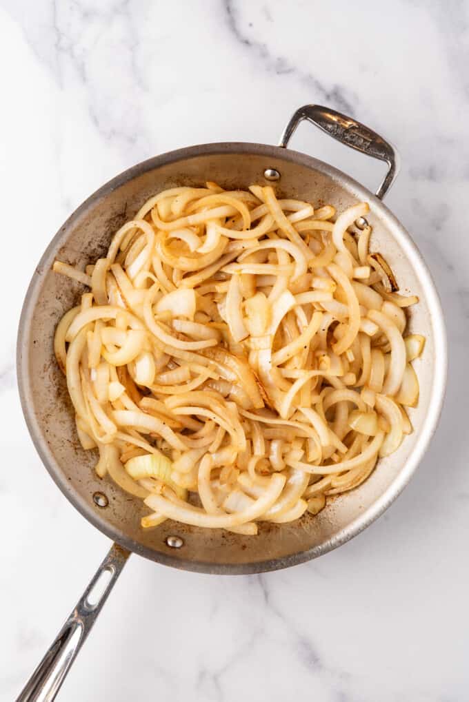 Softened onions in a pan.