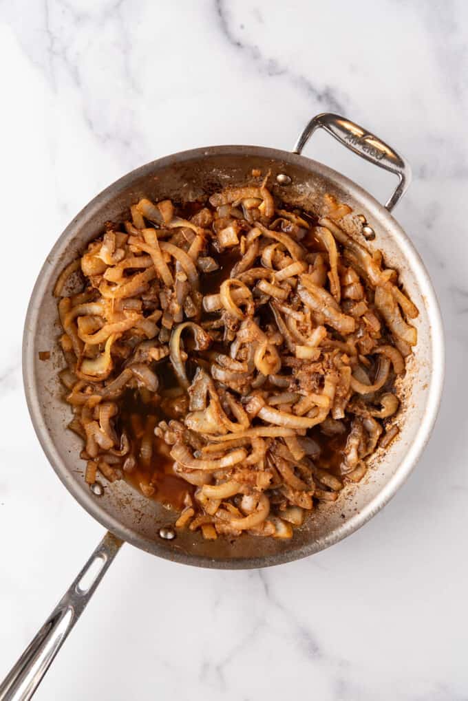 Caramelized  onions in a large pan.