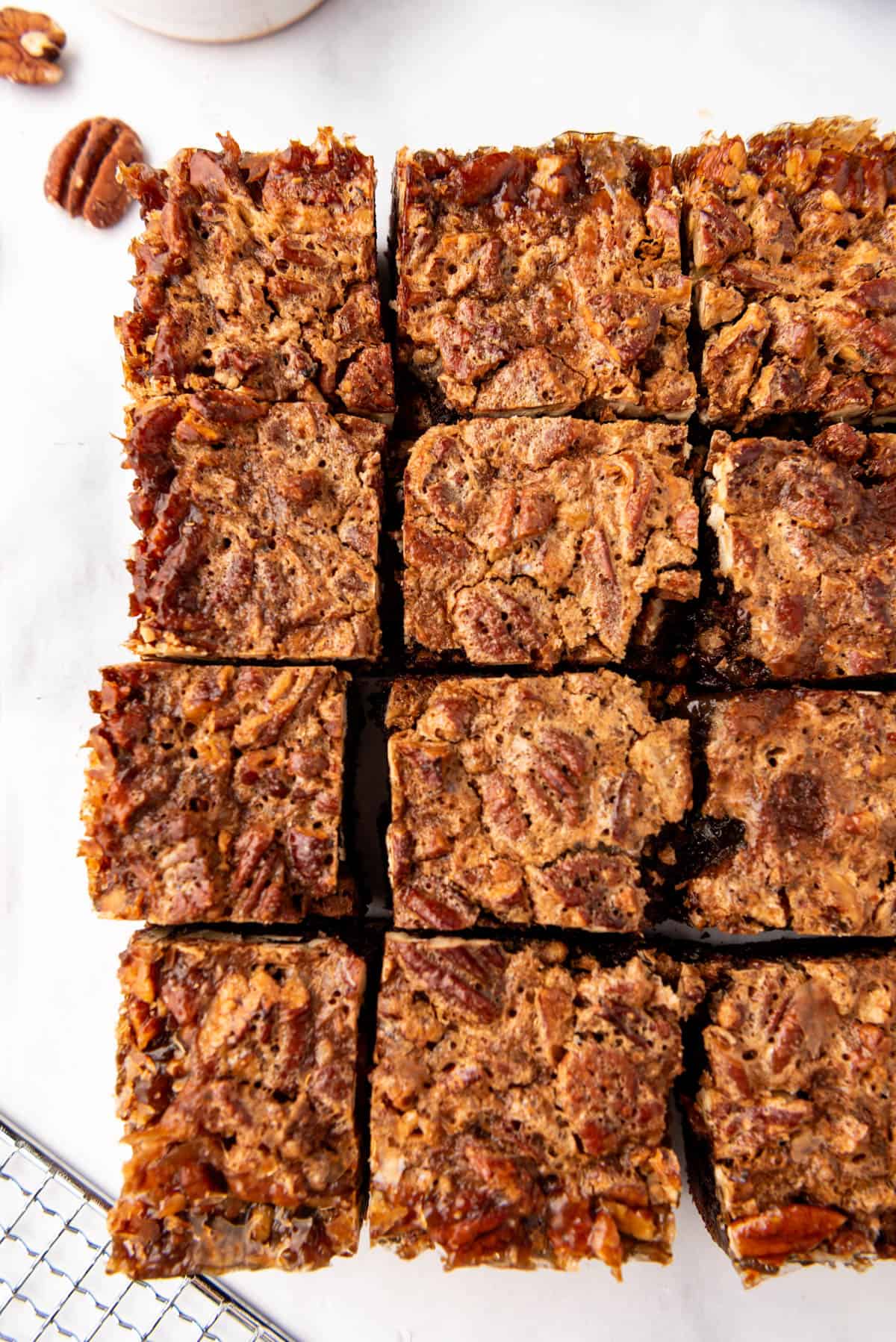 An overhead image of pecan pie brownies that have been cut into squares.