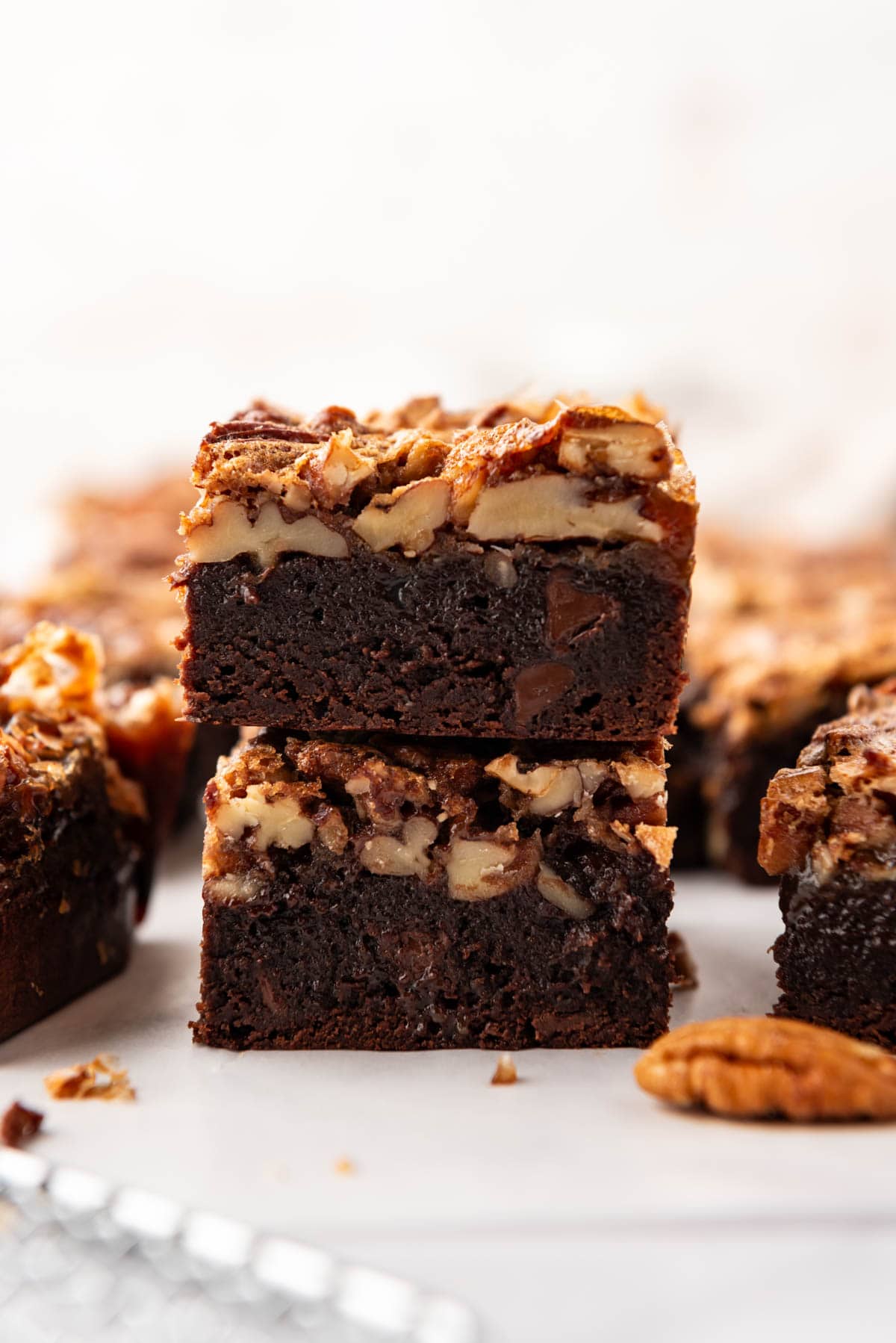 Two stacked pecan pie brownies.