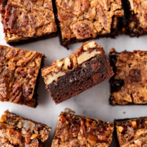 An overhead image of pecan pie brownies cut into squares.