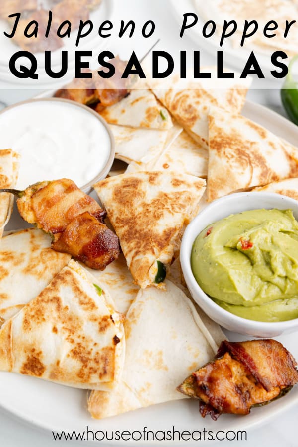 Jalapeno popper quesadillas on a plate with sour cream and guacamole and text overlay.