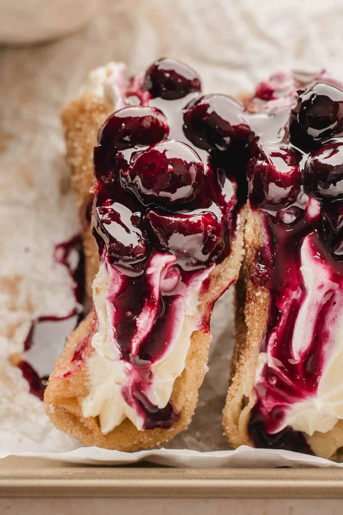 A side view of blueberry cheesecake dessert tacos.