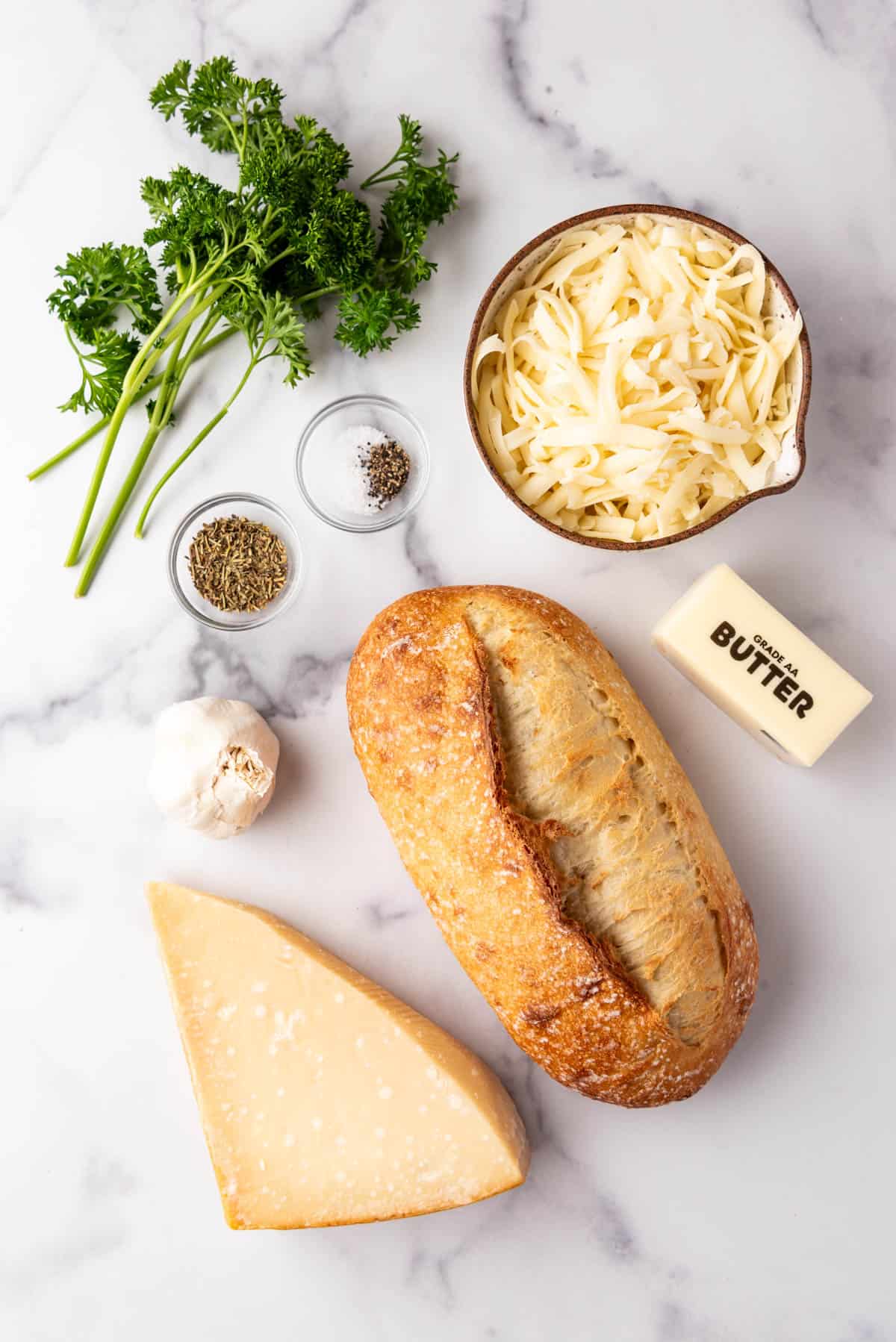 Ingredients for a batch of cheesy garlic bread.