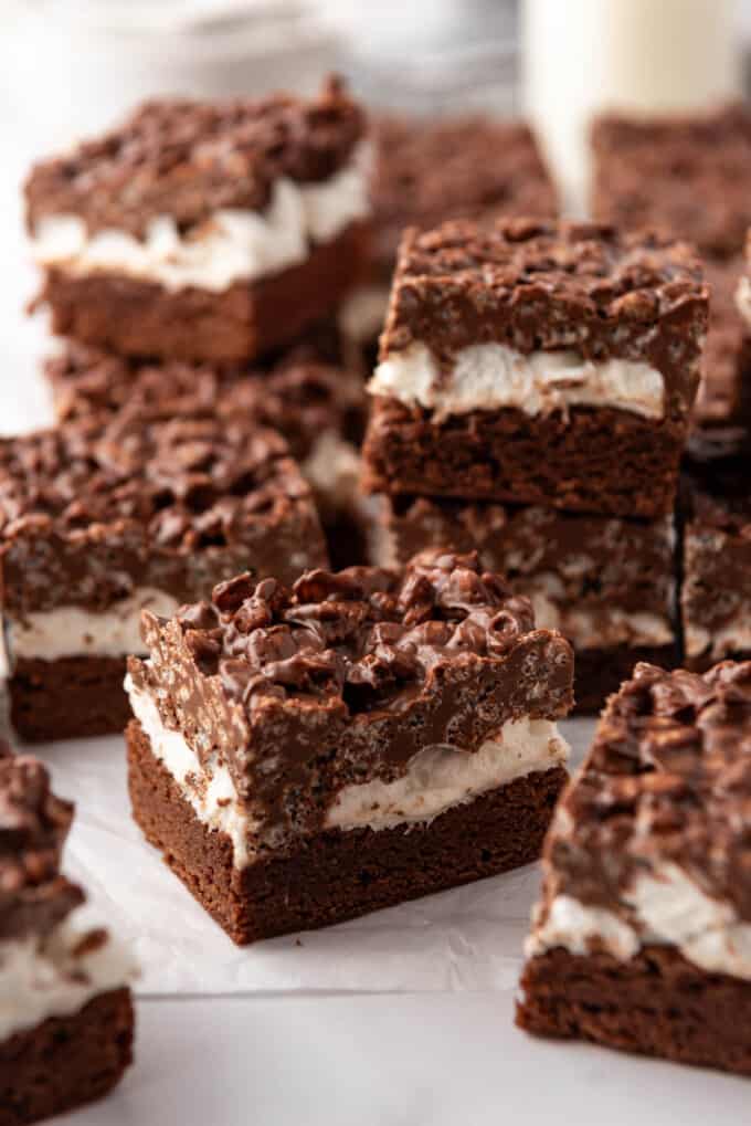 An image of stacked chocolate peanut butter rice krispies brownies.