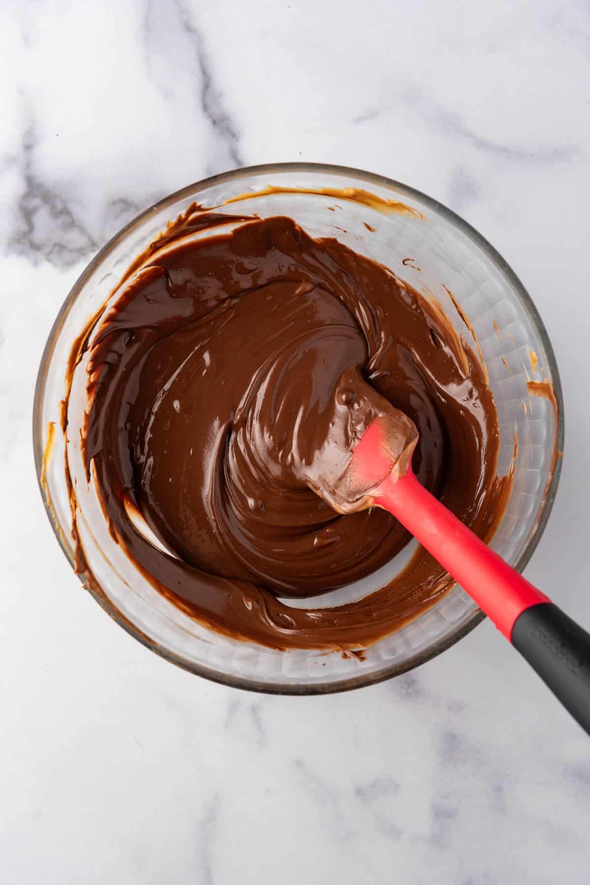 Melted peanut butter and chocolate in a mixing bowl.