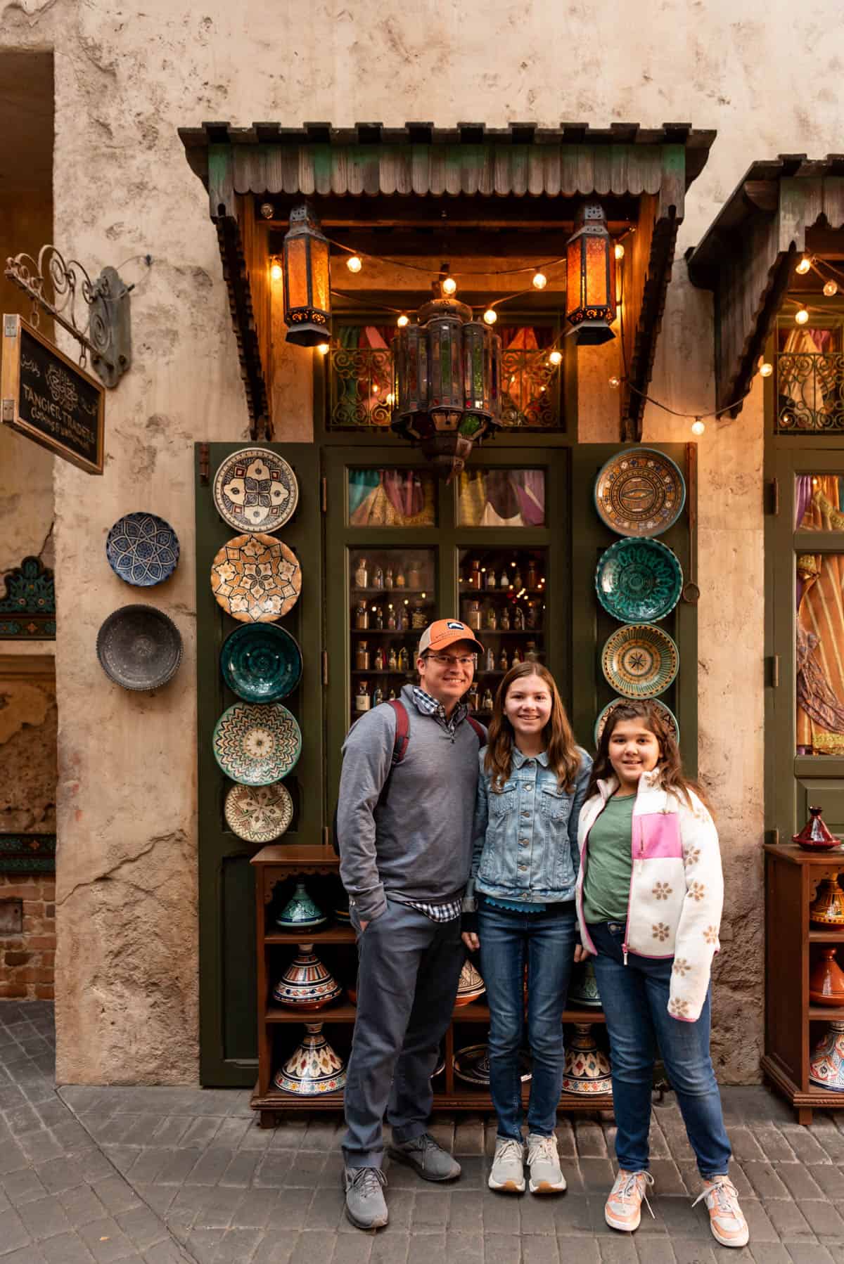 A dad and two girls in the Morocco section of Epcot.