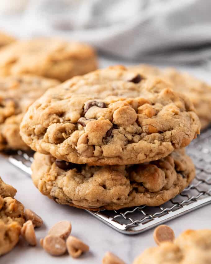 Two stacked peanut butter oatmeal chocolate chip cookies.