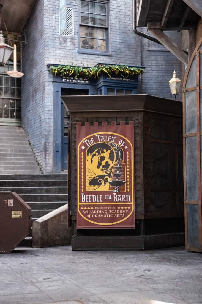 An image of the sign for the Tales of Beedle the Bard performance at the Wizarding World of Harry Potter.
