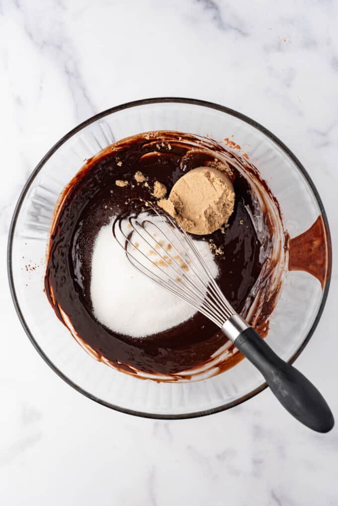 Whisking sugars into brownie batter.