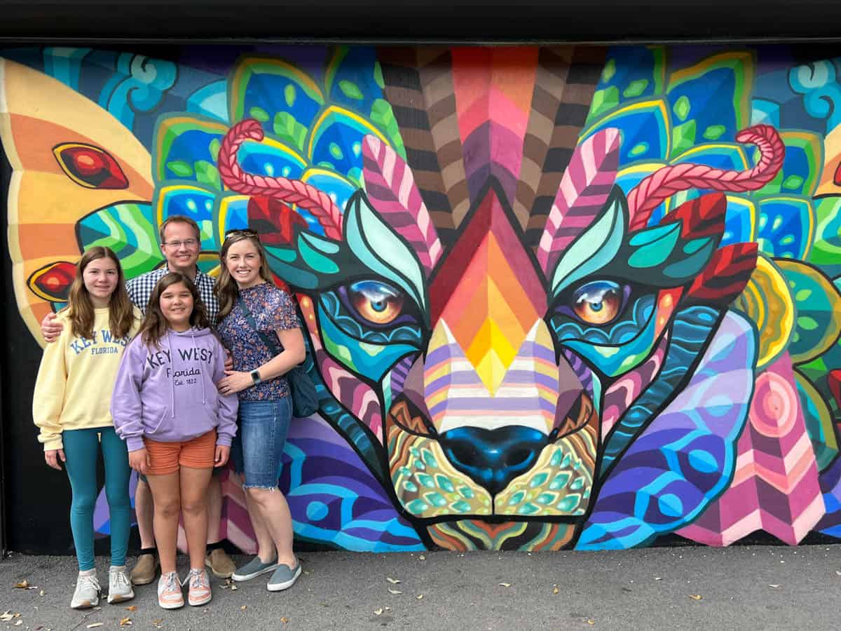 An image of a family in front of a mural at Wynwood Walls in Miami.