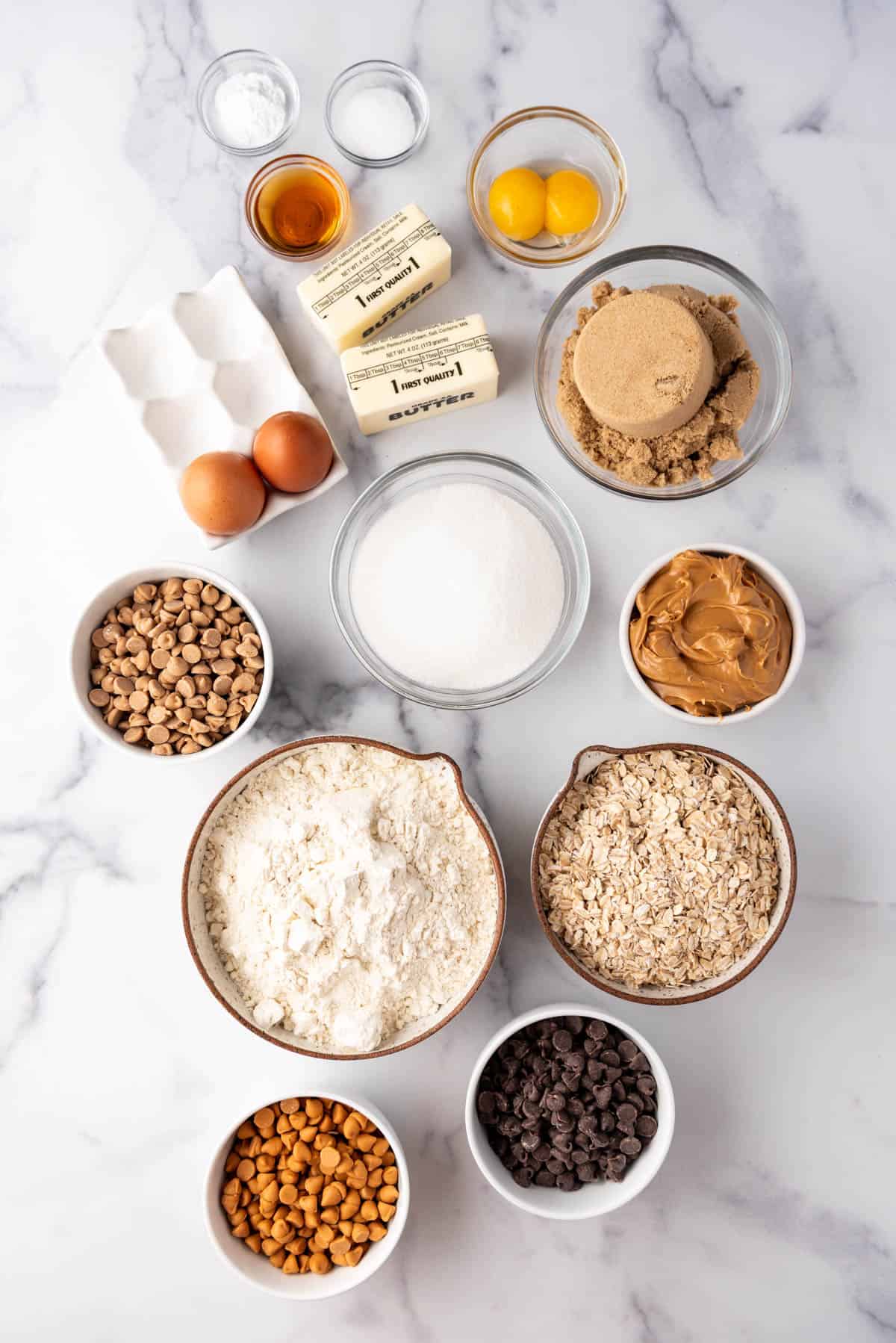 An image of ingredients for peanut butter oatmeal butterscotch chocolate chip cookies.