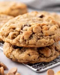 Two stacked peanut butter oatmeal chocolate chip cookies.