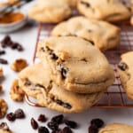 An image of two raisin-filled cookies stacked on top of each other.