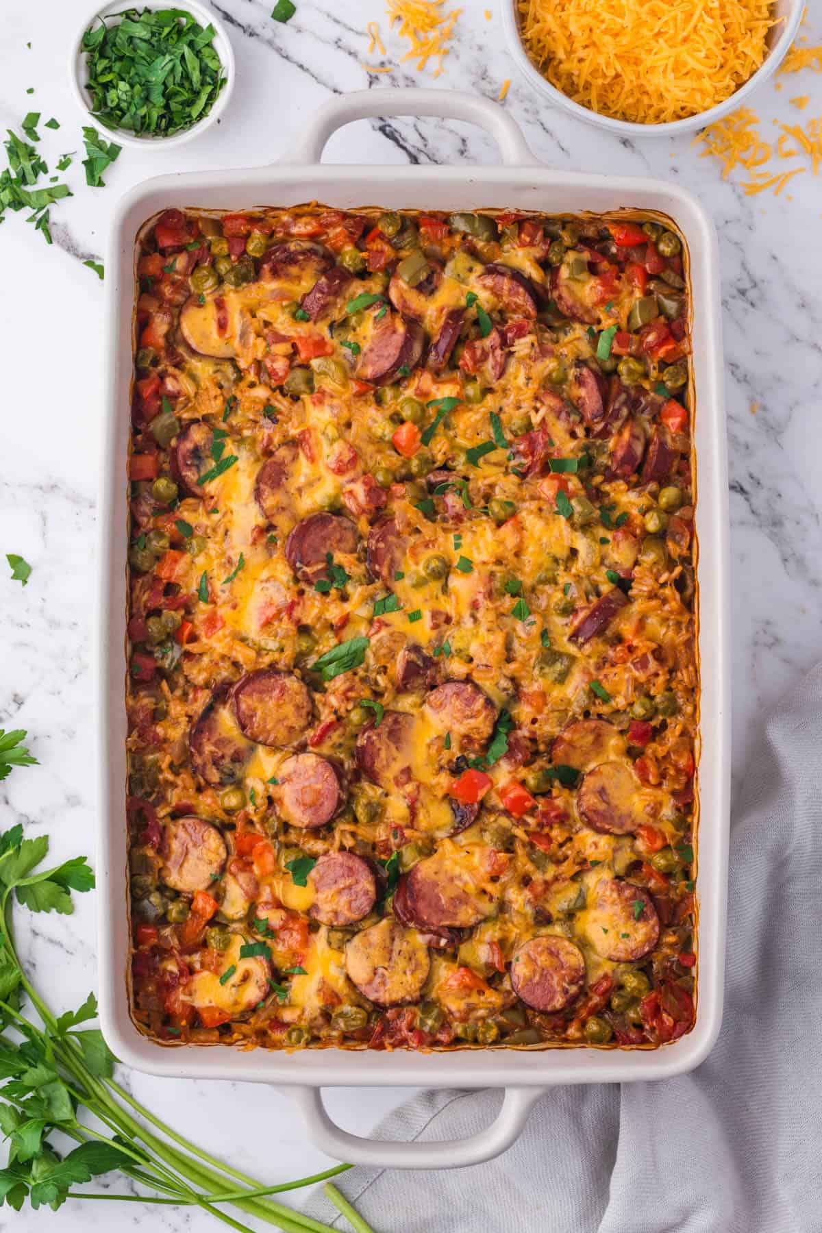An overhead image of a 9x13 pan of sausage and rice casserole.