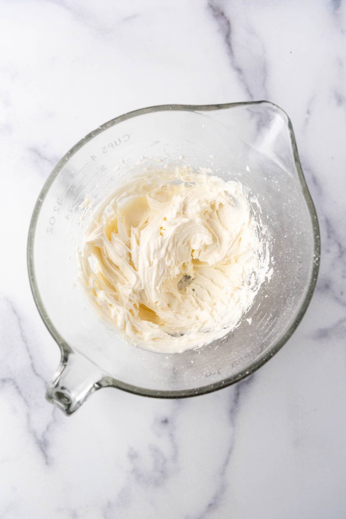 Cream cheese frosting in a bowl.