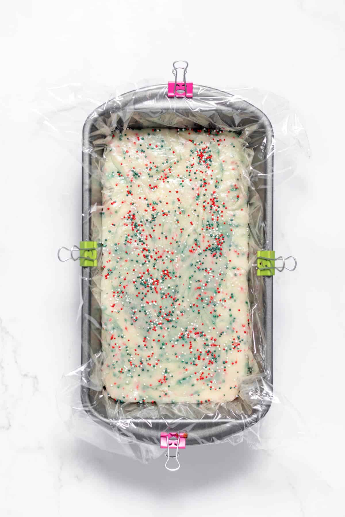 Sugar cookie fudge in a loaf pan ready to set up.