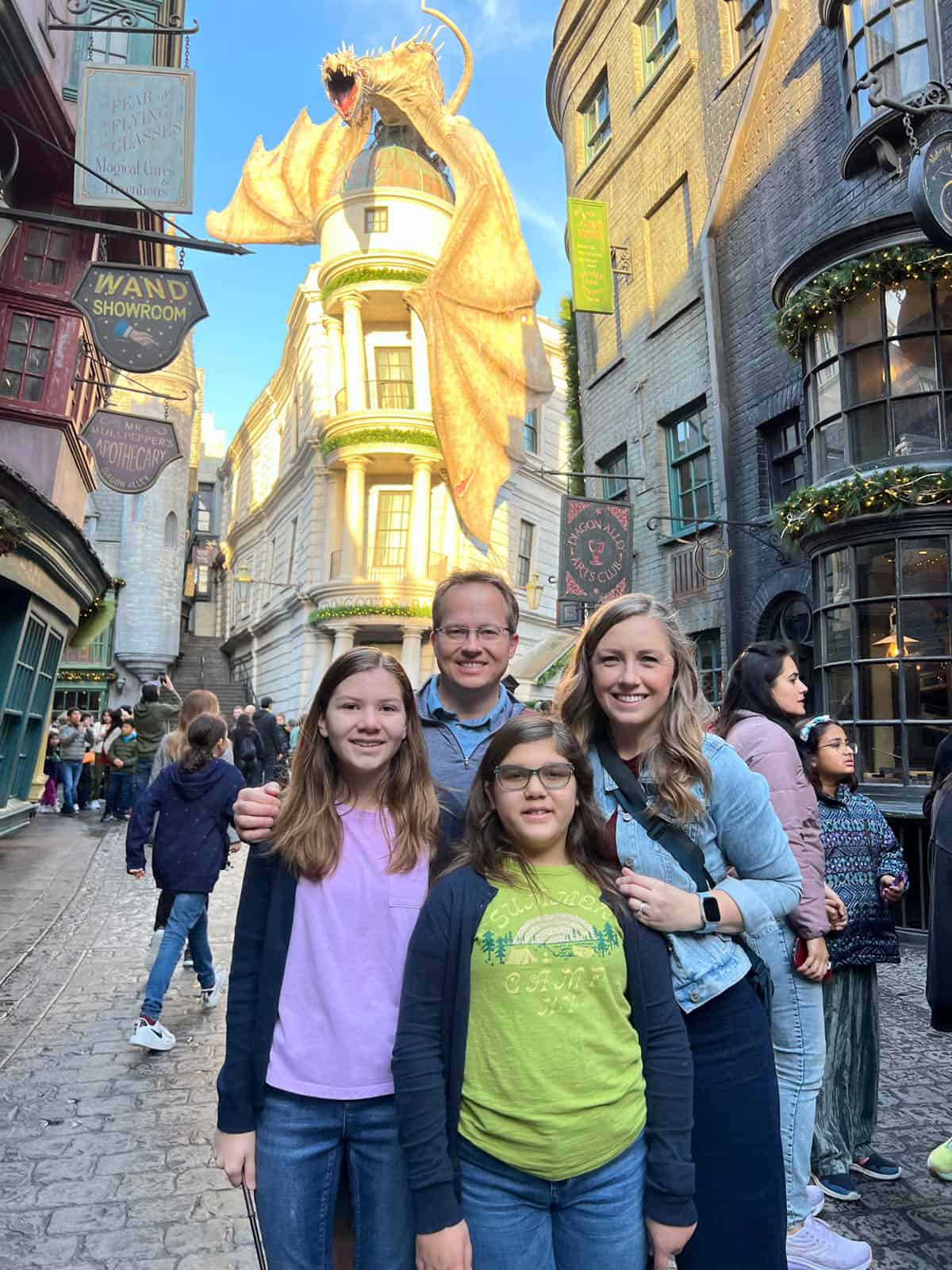 A family of four at the Wizarding World of Harry Potter in Universal Studios, Orlando.