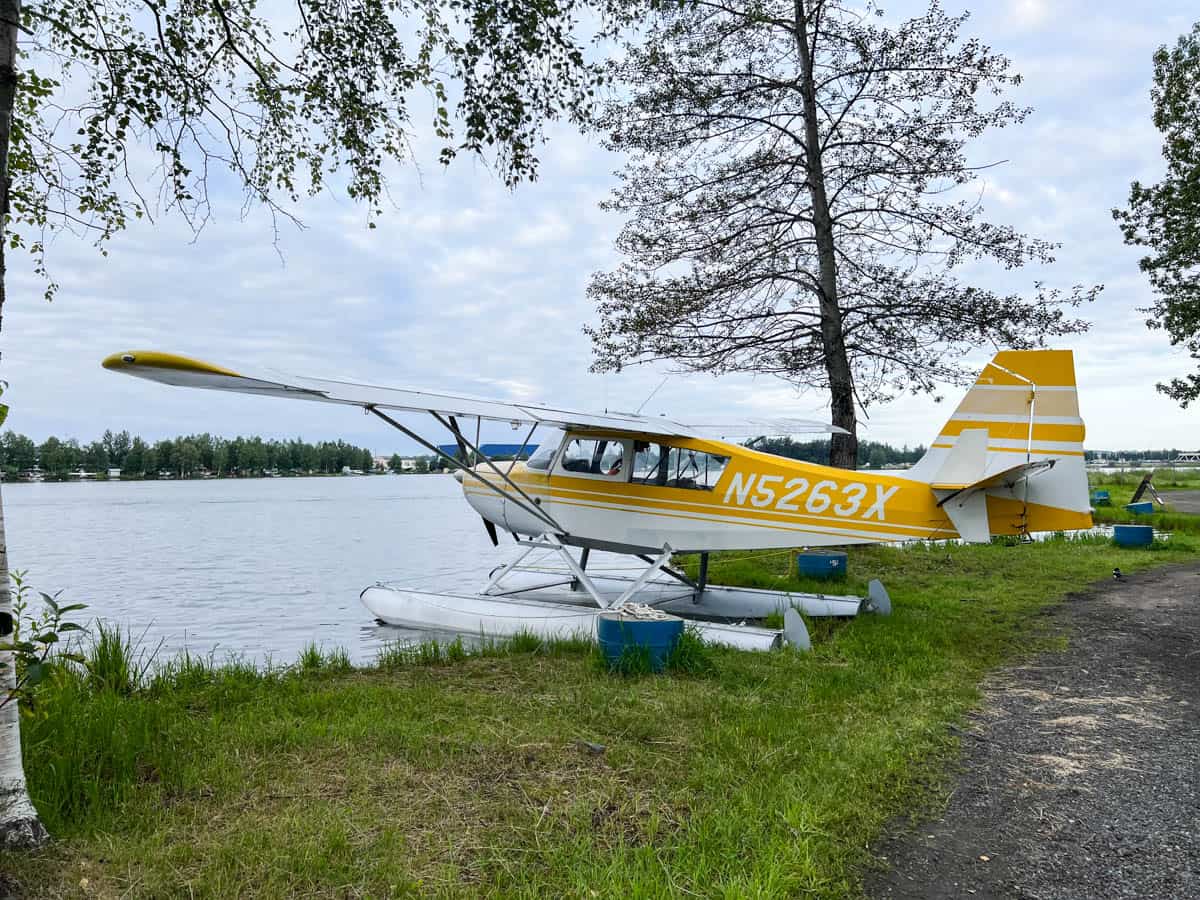 A white and yellow seaplane.