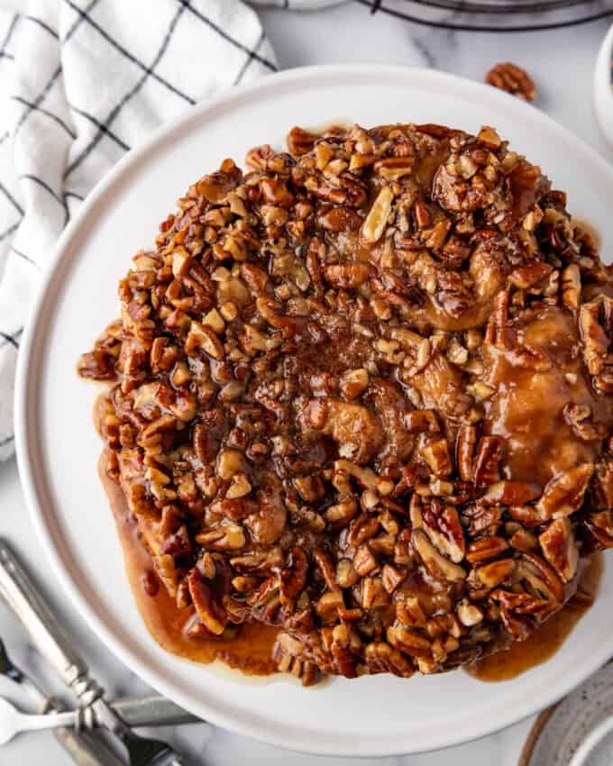 An overhead image of sticky buns with lots of chopped pecans.