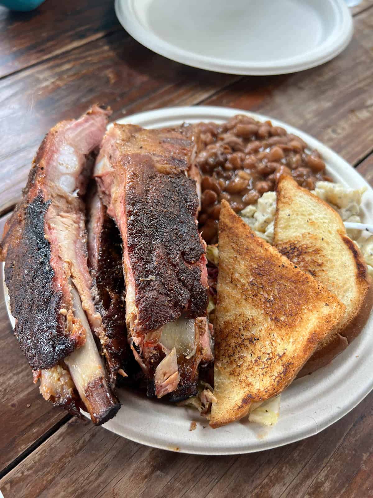 A plate of bbq food.