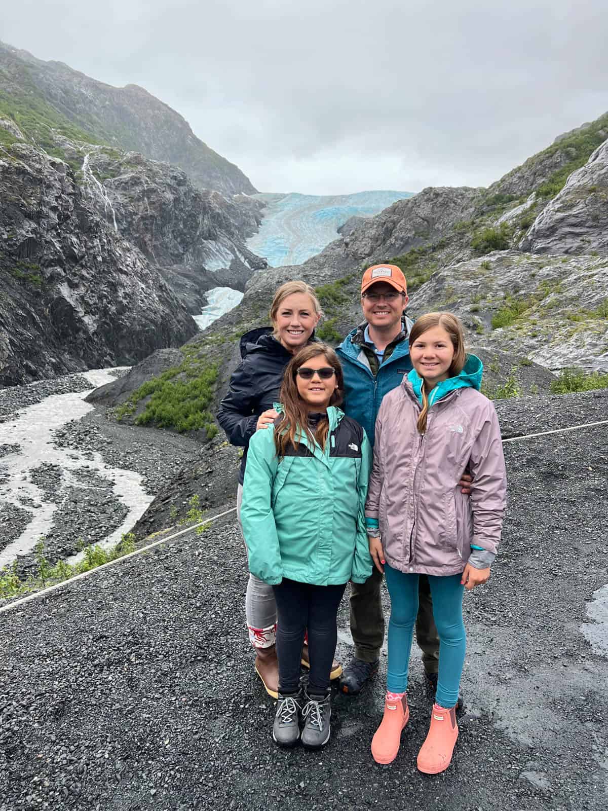 A family standing in front of Exit Glacier.