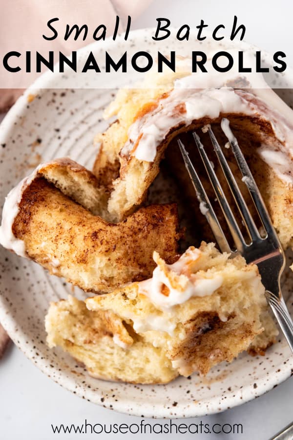 A cinnamon roll being pulled apart on a plate with text overlay.