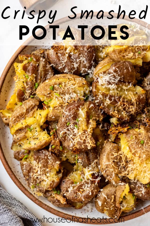 An overhead image of crispy smashed potatoes on a plate with text overlay.