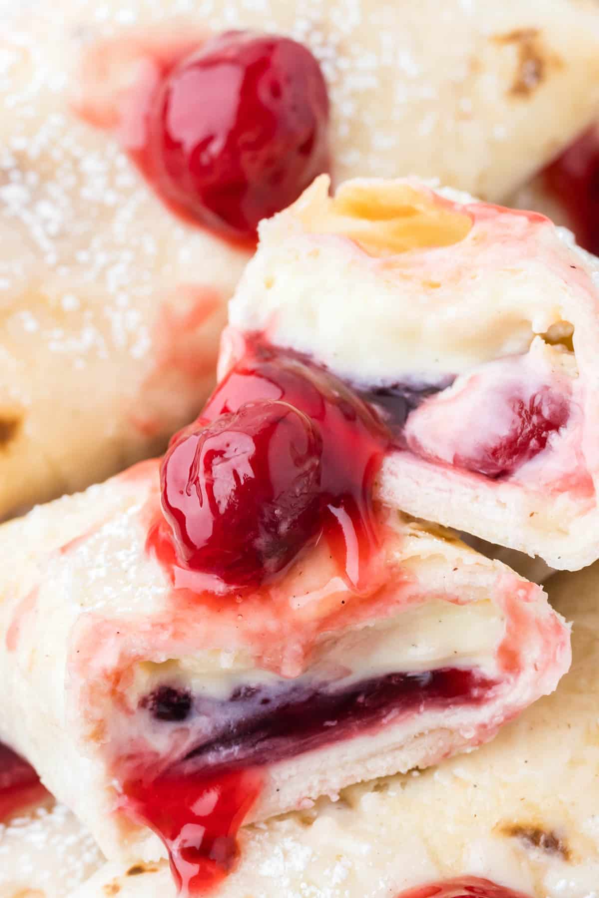 A close image of cherry cheesecake chimichangas.
