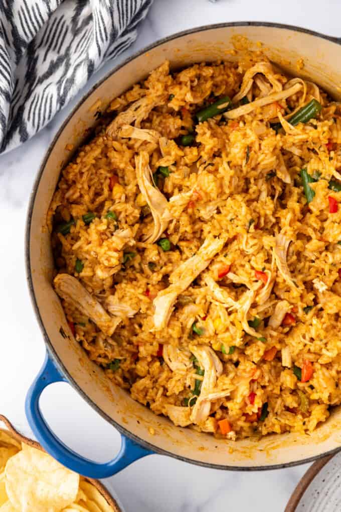 An overhead image of a pot of Costa Rican rice with chicken.