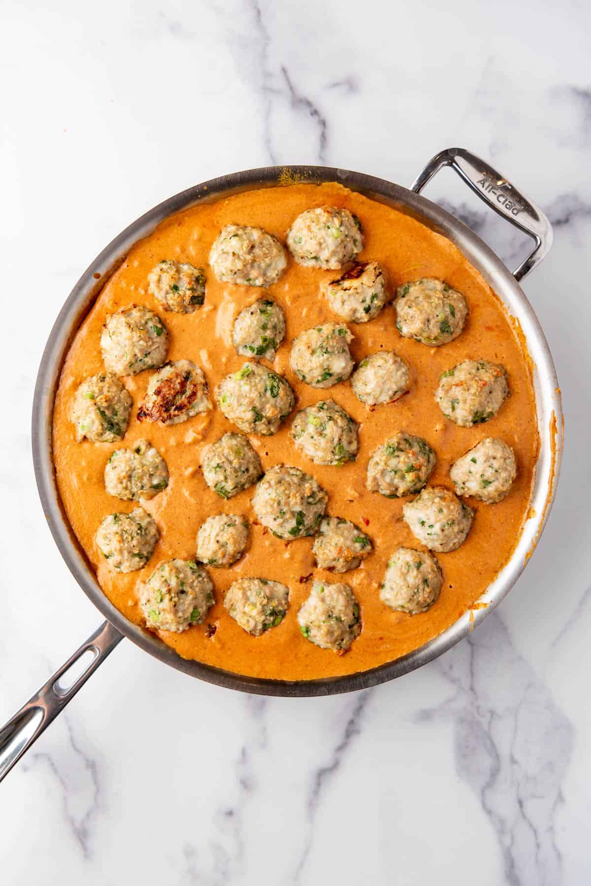 Baked chicken meatballs in a coconut curry sauce.