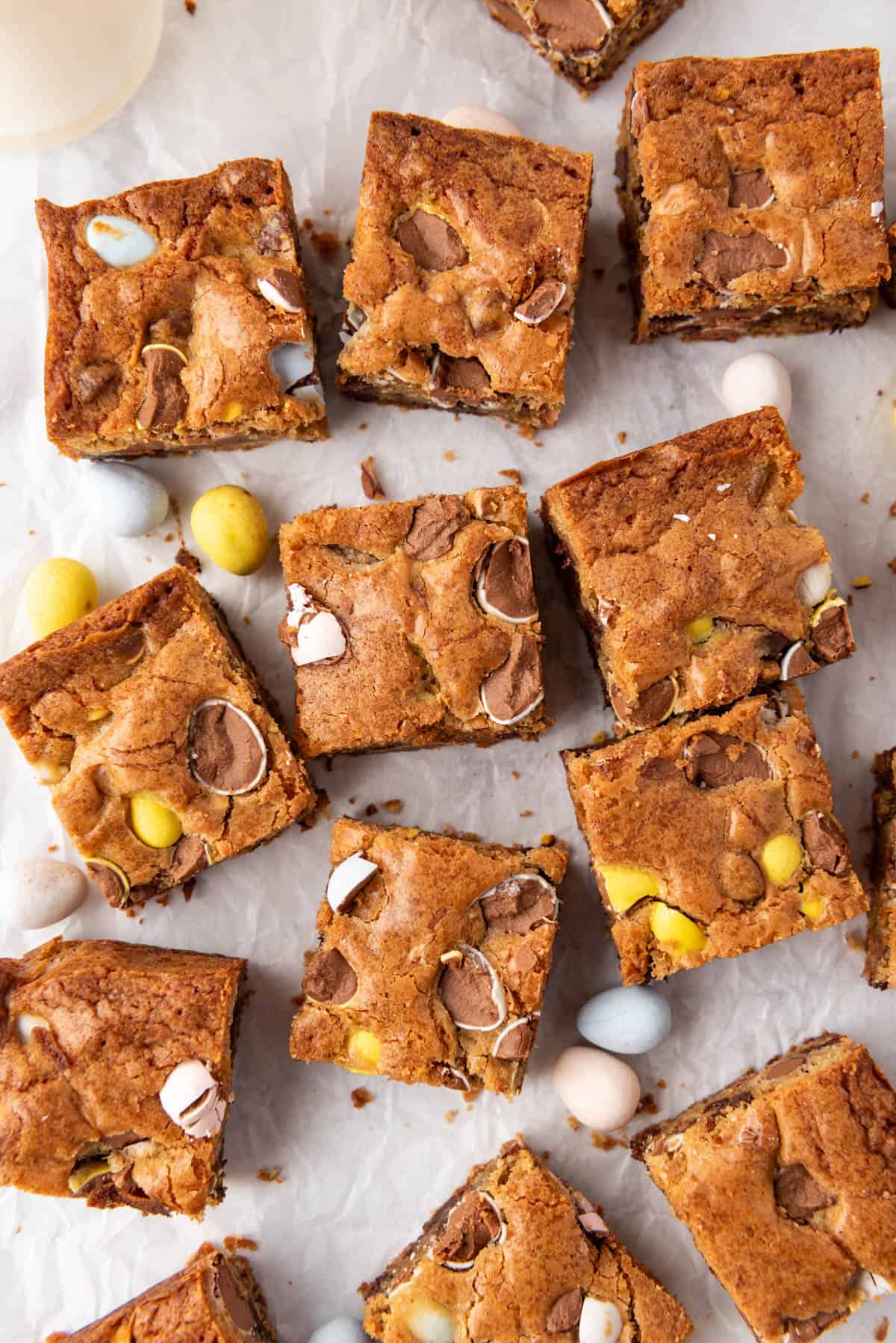 An overhead image of Easter blondies made with Cadbury mini eggs cut into squares.