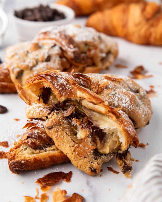 An image of a flaky cookie croissant that has been torn in half.