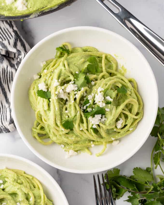 An overhead image of a bowl of spaghetti verde.