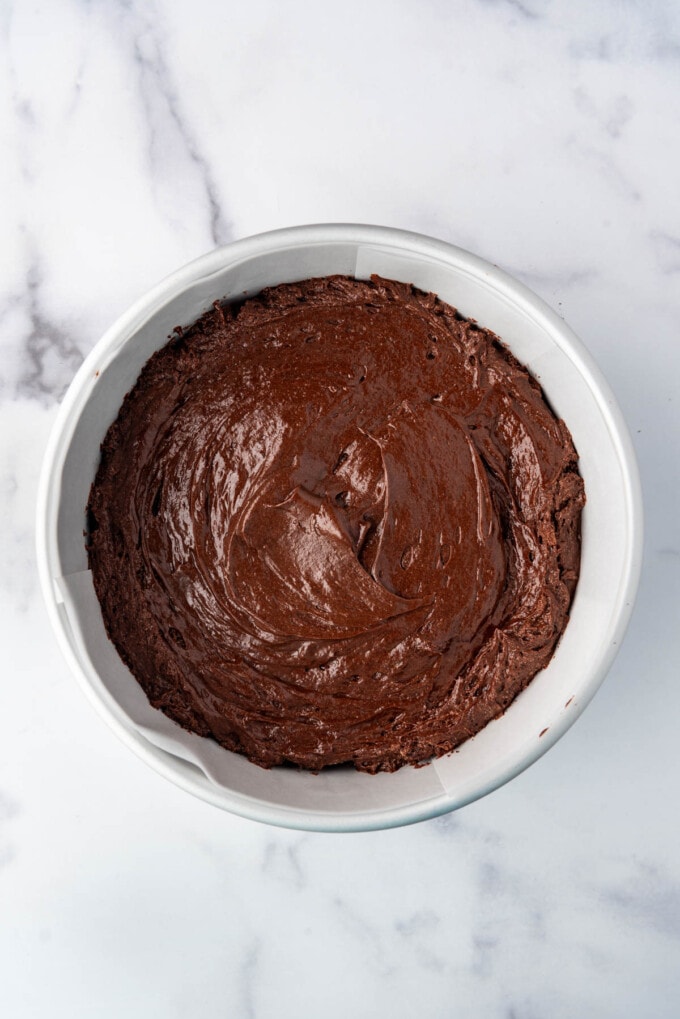 Flourless chocolate cake batter in a cake pan.