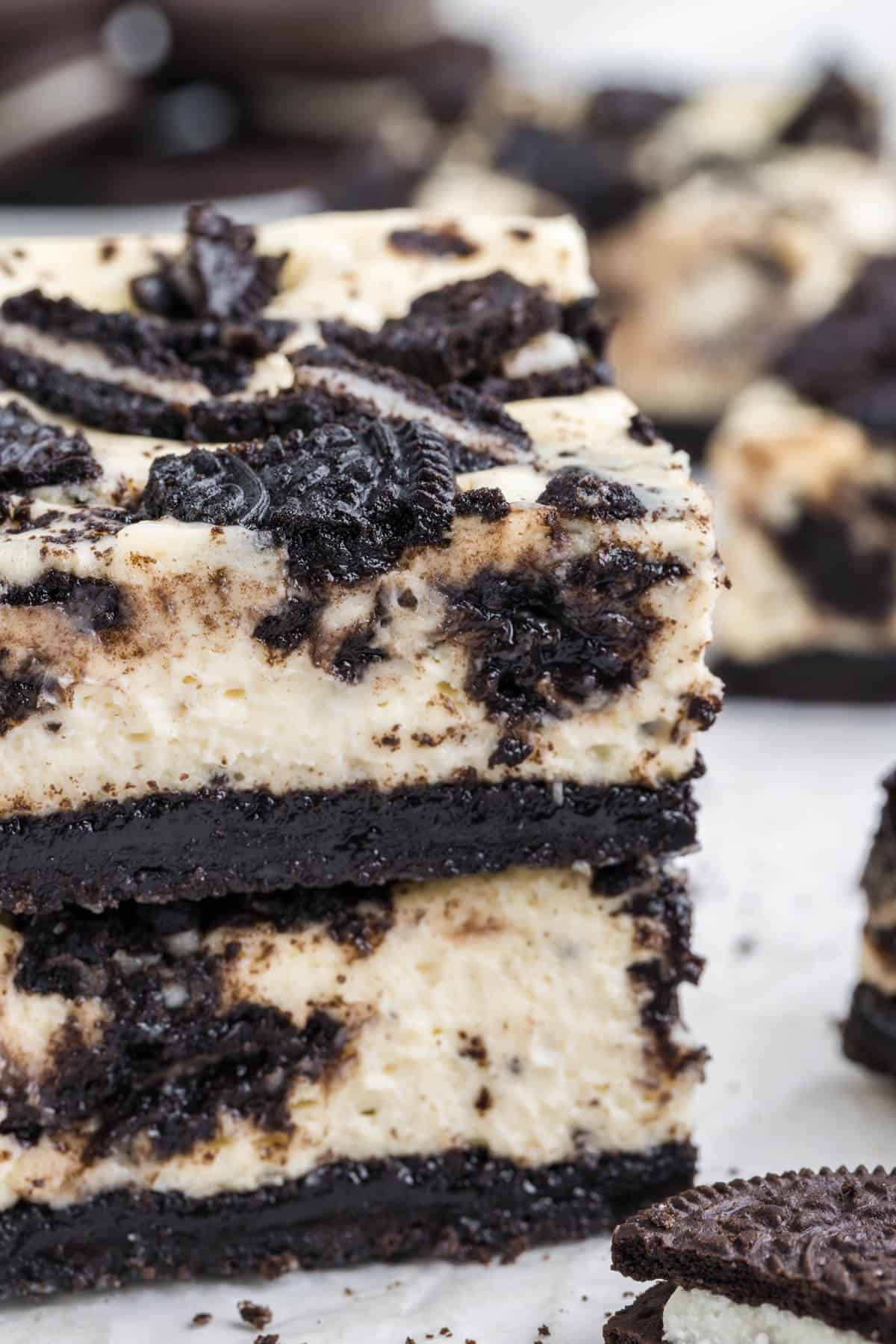 A close up image of the texture of creamy Oreo cheesecake bars.