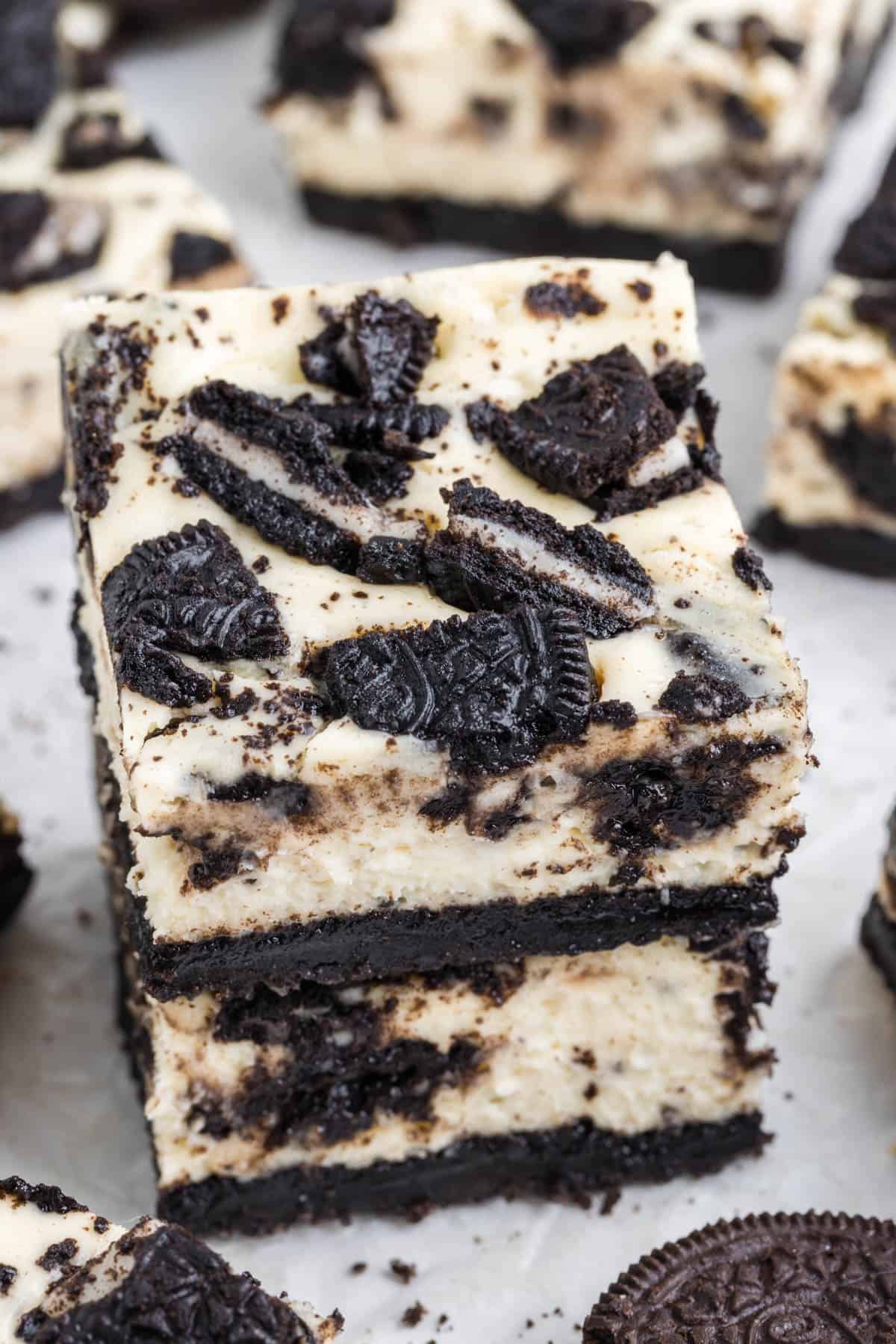 An image of two stacked oreo cheesecake bars.