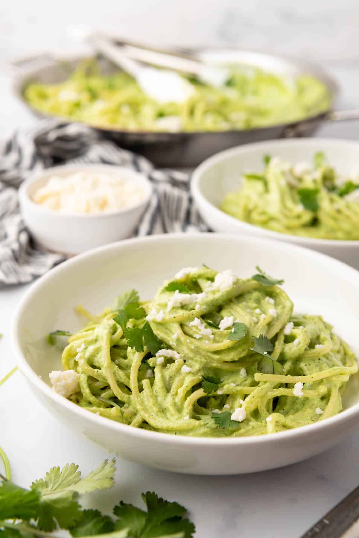 An image of pasta bowls of spaghetti verde.