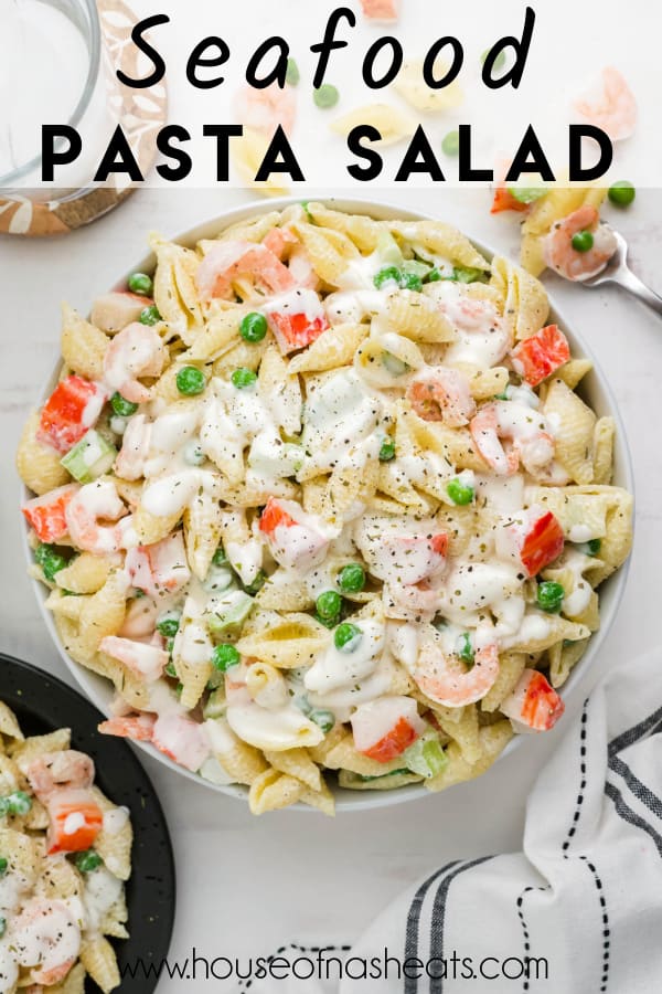 An overhead image of seafood pasta salad with text overlay.