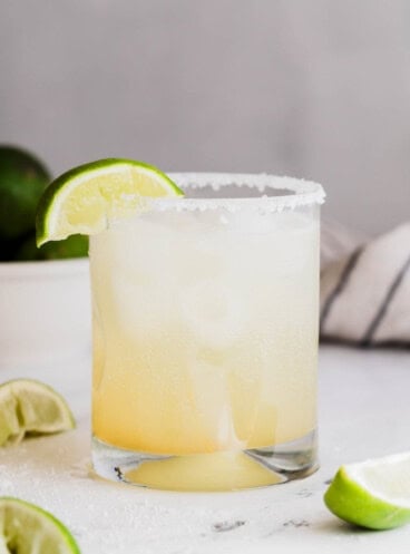 A margarita mocktail with a lime wedge.