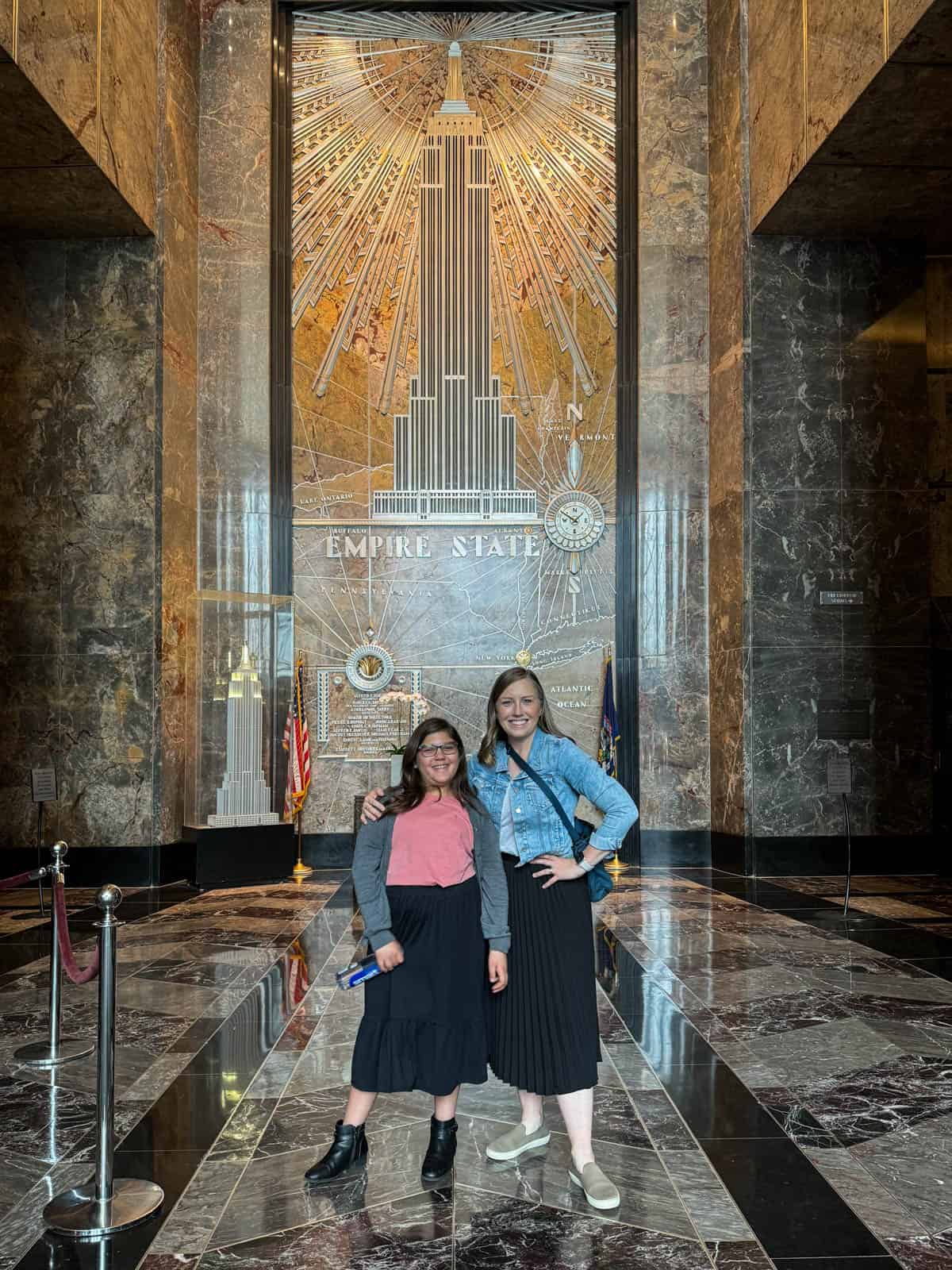 A mom and her daughter in the Empire State Building.