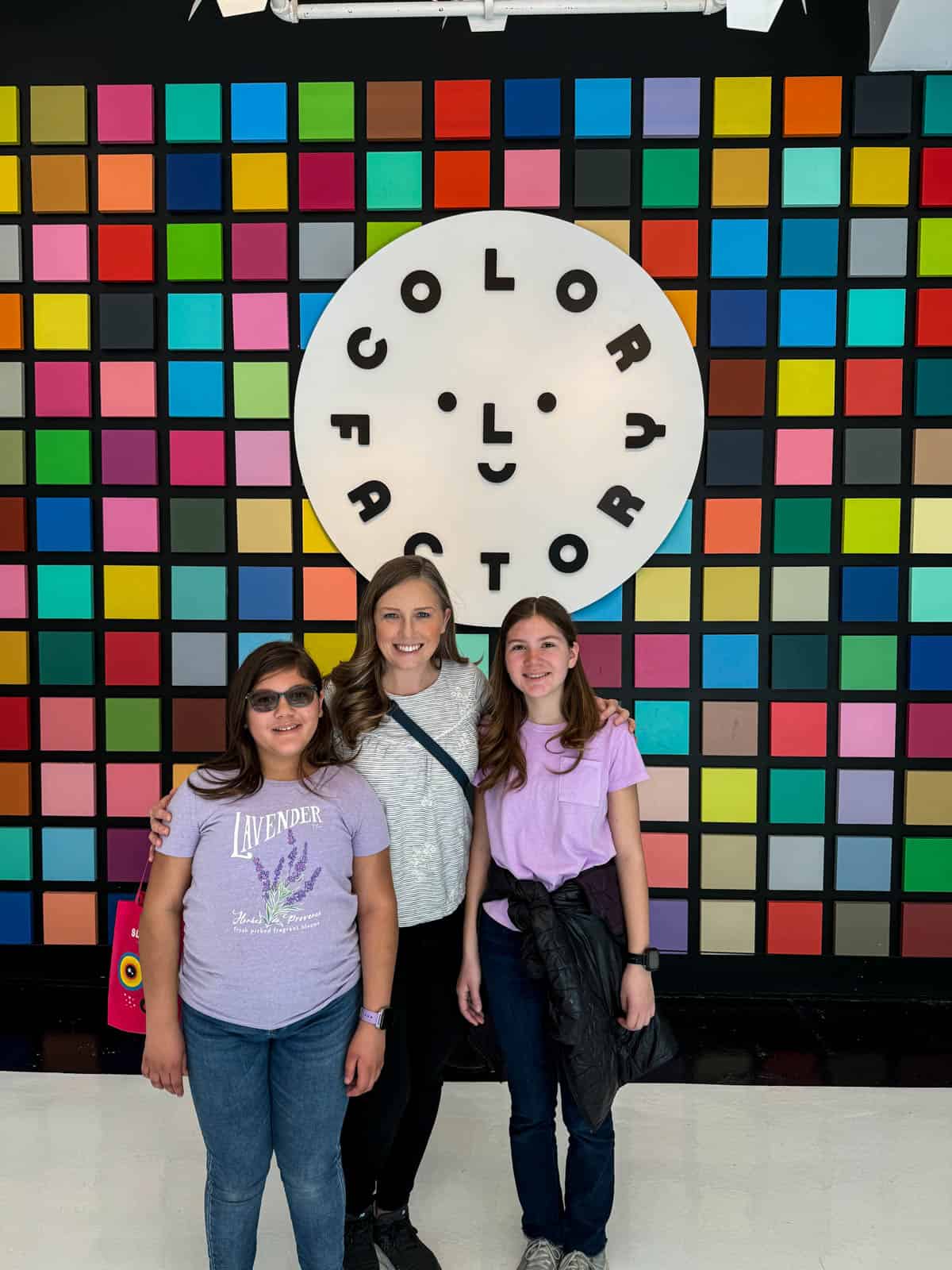 A mom and two kids at the Color Factory in New York.