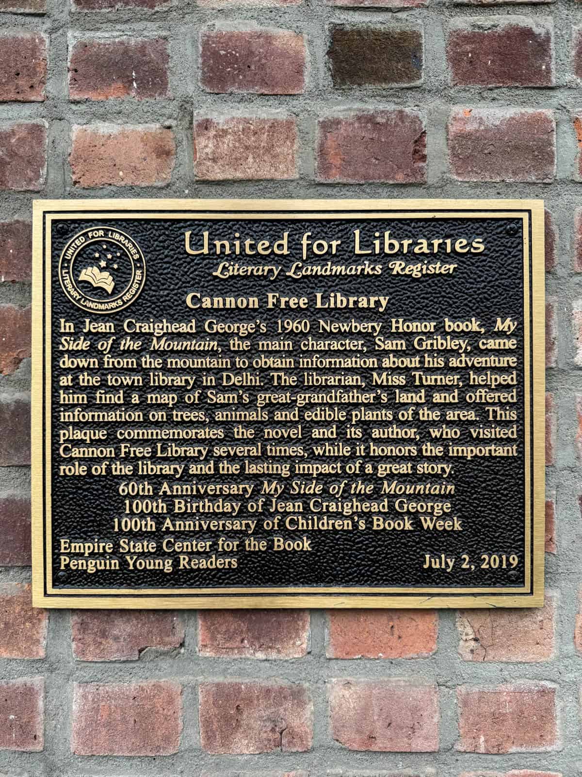 A plaque on the front of the Cannon Free Library.