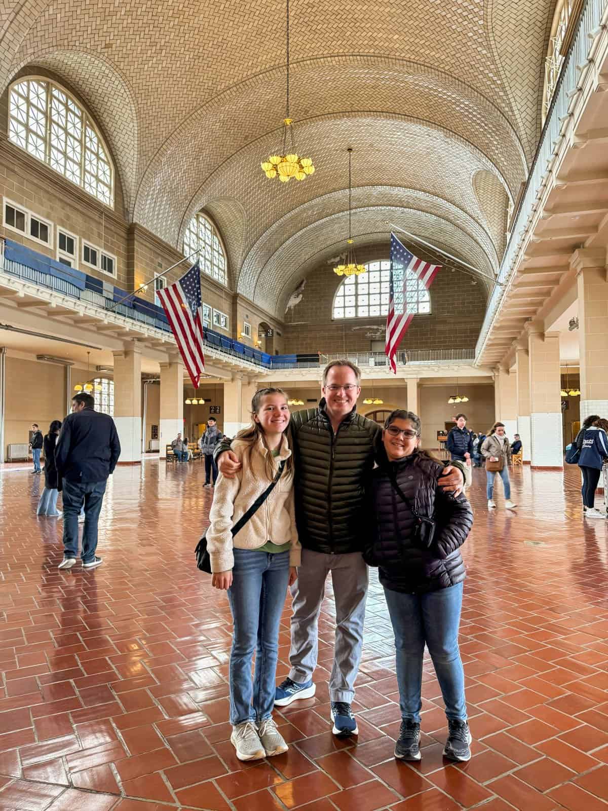 A dad and two daughters on Ellis Island.